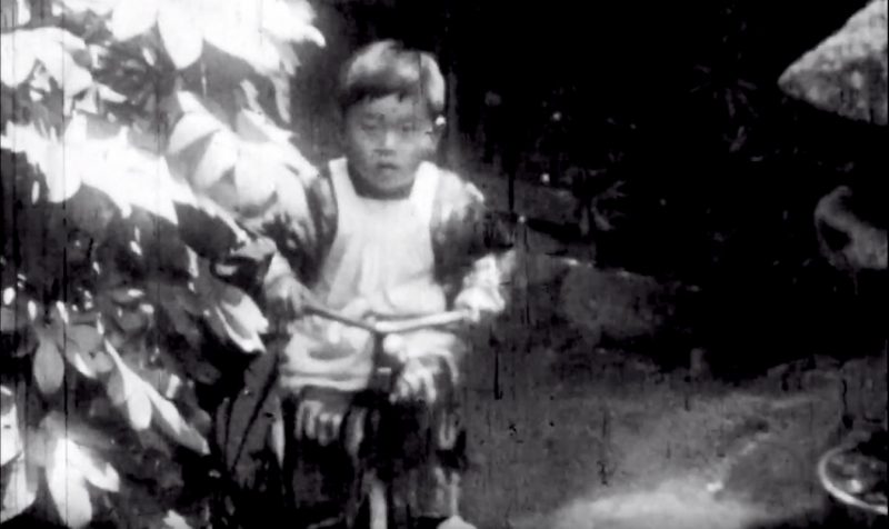 boy on tricycle