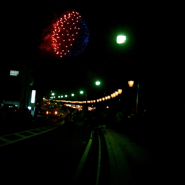 Lanterns along the street and fireworks in the sky... aaah Japan