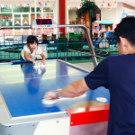Air hockey- family fun in the arcade