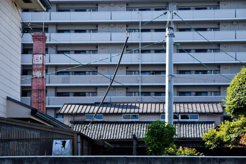 Kokki sake brewery is dwarfed by modern apartment building