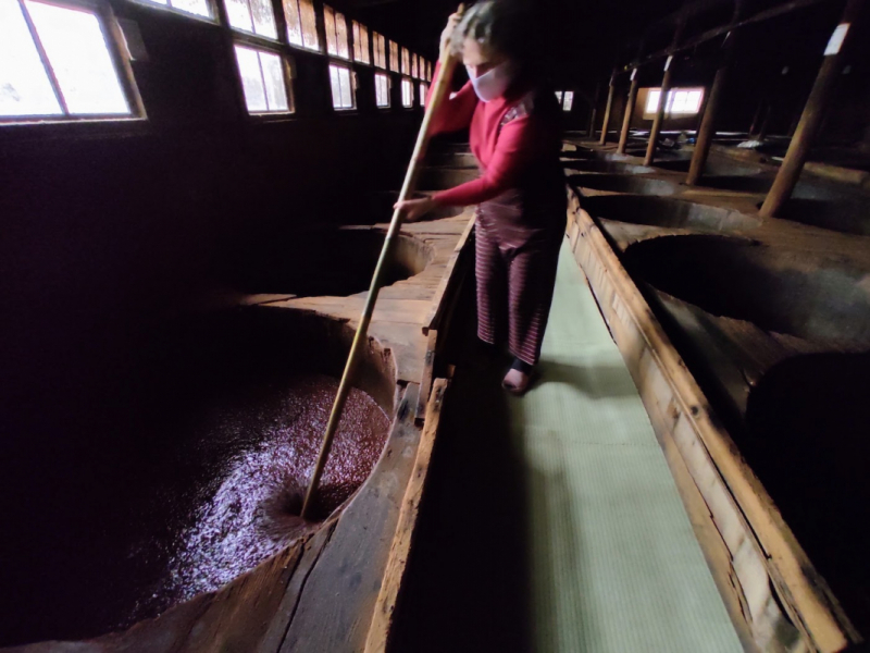 Stiring the moromi soy mash at Moriyama Shoyu