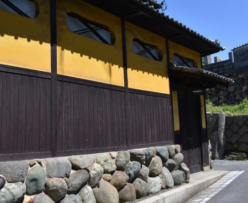 Yellow plaster and wood house