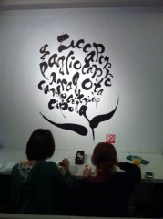 diners in front of wall mural