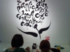 diners in front of wall mural