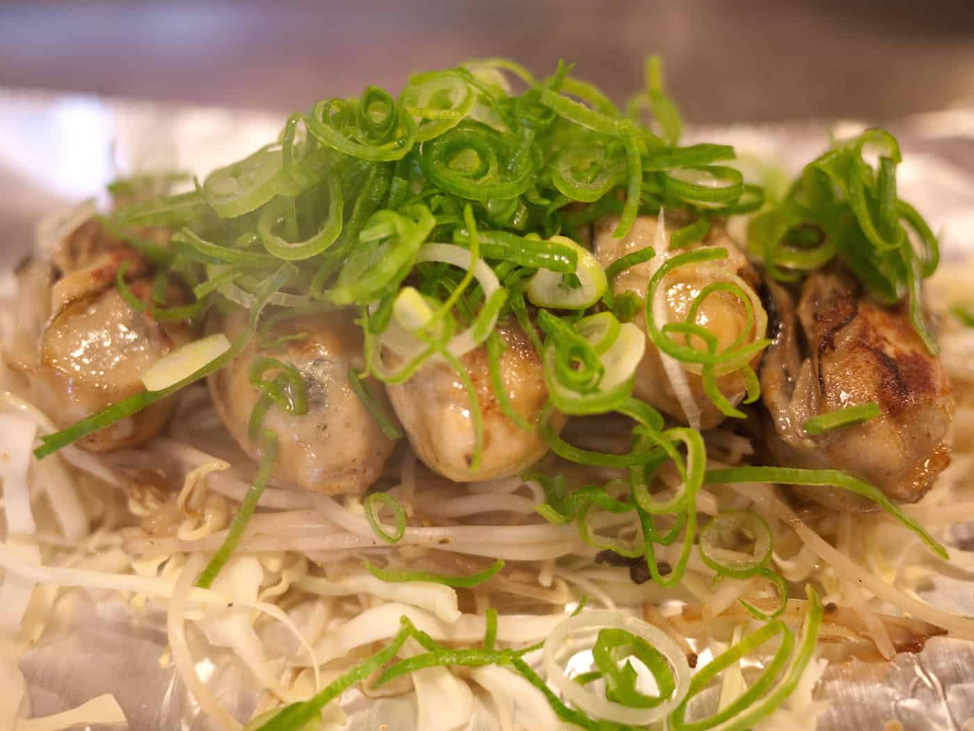 Grilled oysters at Nagata-ya Okonomiyaki near Hiroshima Peace Memorial Park in Japan