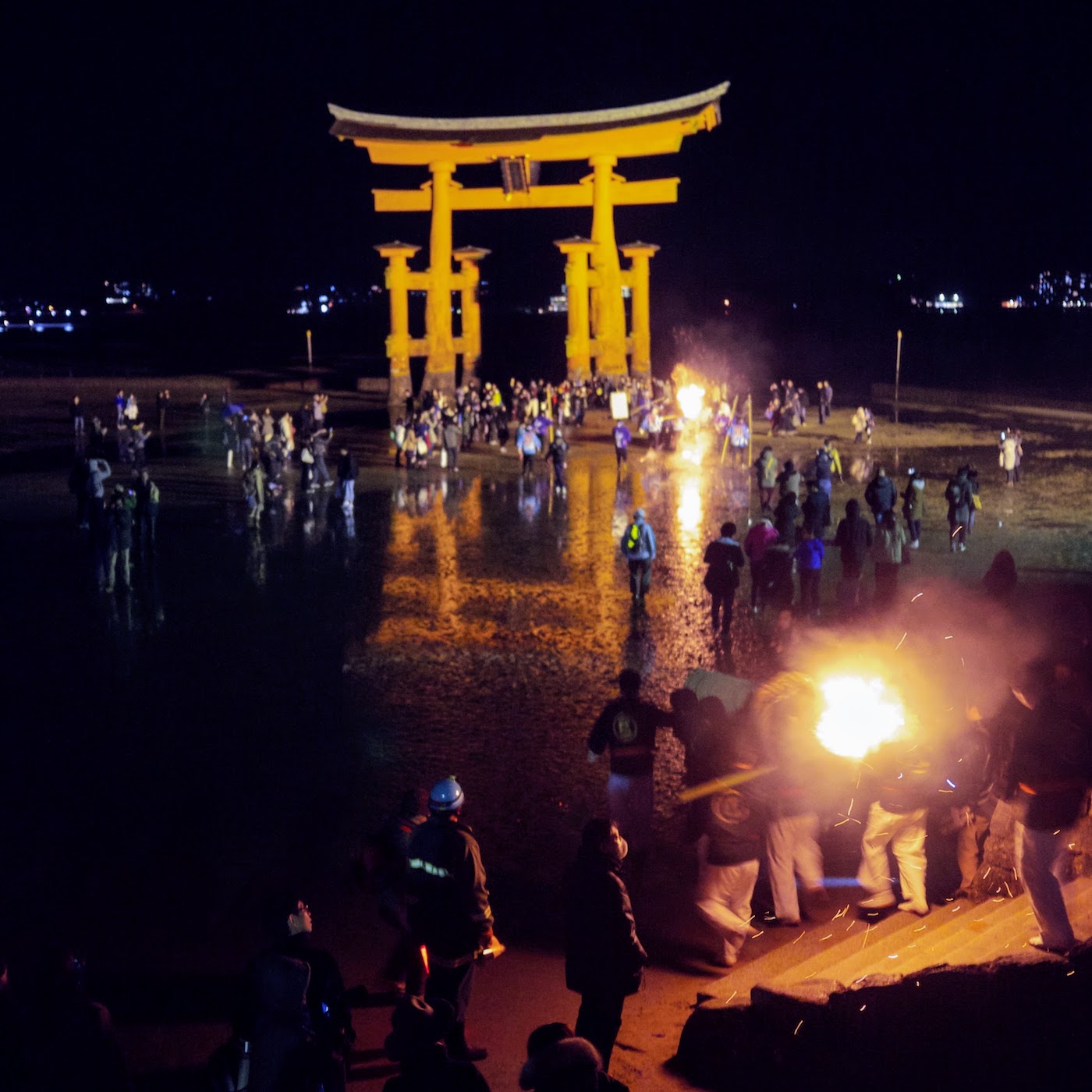 Torches head down to the great torii gate